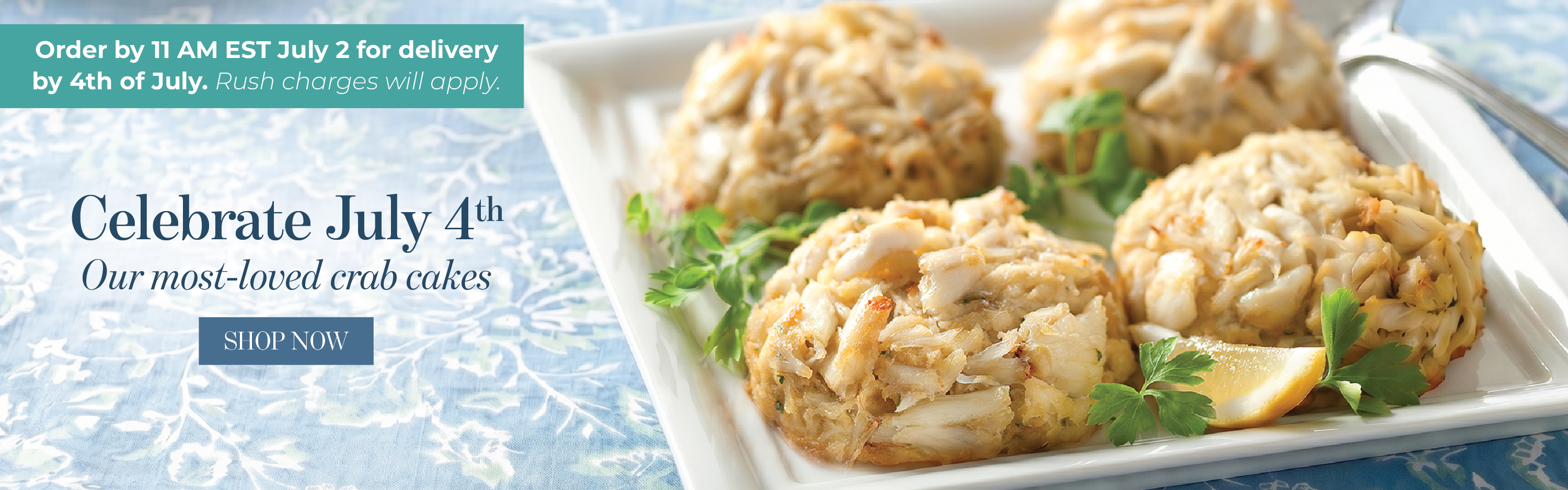 Four buttery crab cakes on a square platter