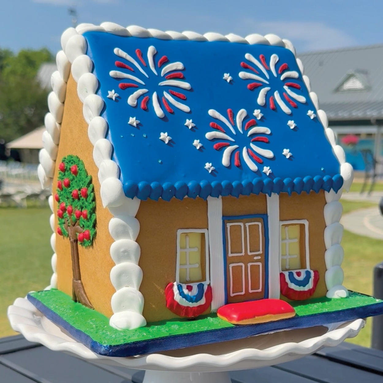 Star-Spangled Cookie House with apple tree on left side