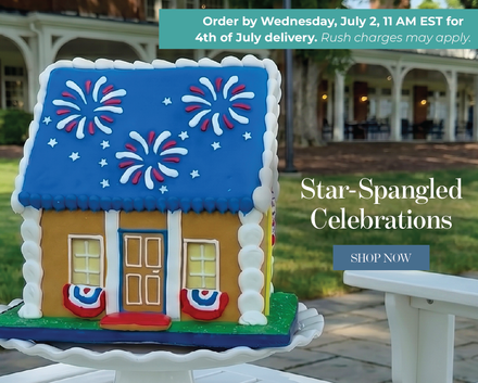 The delicious vanilla Star-Spangled Cookie House presented on an outdoor patio to celebrate the holiday in a sweet fashion.