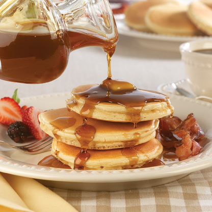 Classic Pancake Breakfast with bacon and maple syrup.