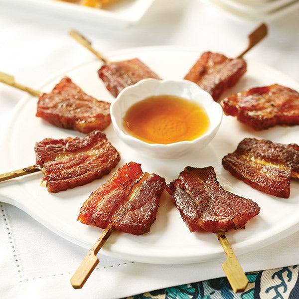 Bacon Lollipops on skewers served Vanilla-Bourbon Glaze